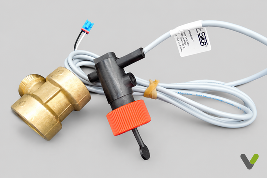 SIKA flow switch brass valve and actuator with cable on flat light-grey background and corner V logo